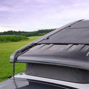 Semi-flexible solar panel on VW California camper roof with pop top, outdoor setting