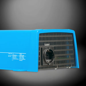 Blue Victron Phoenix 12 1200 inverter with AC output socket, close-up on dark background